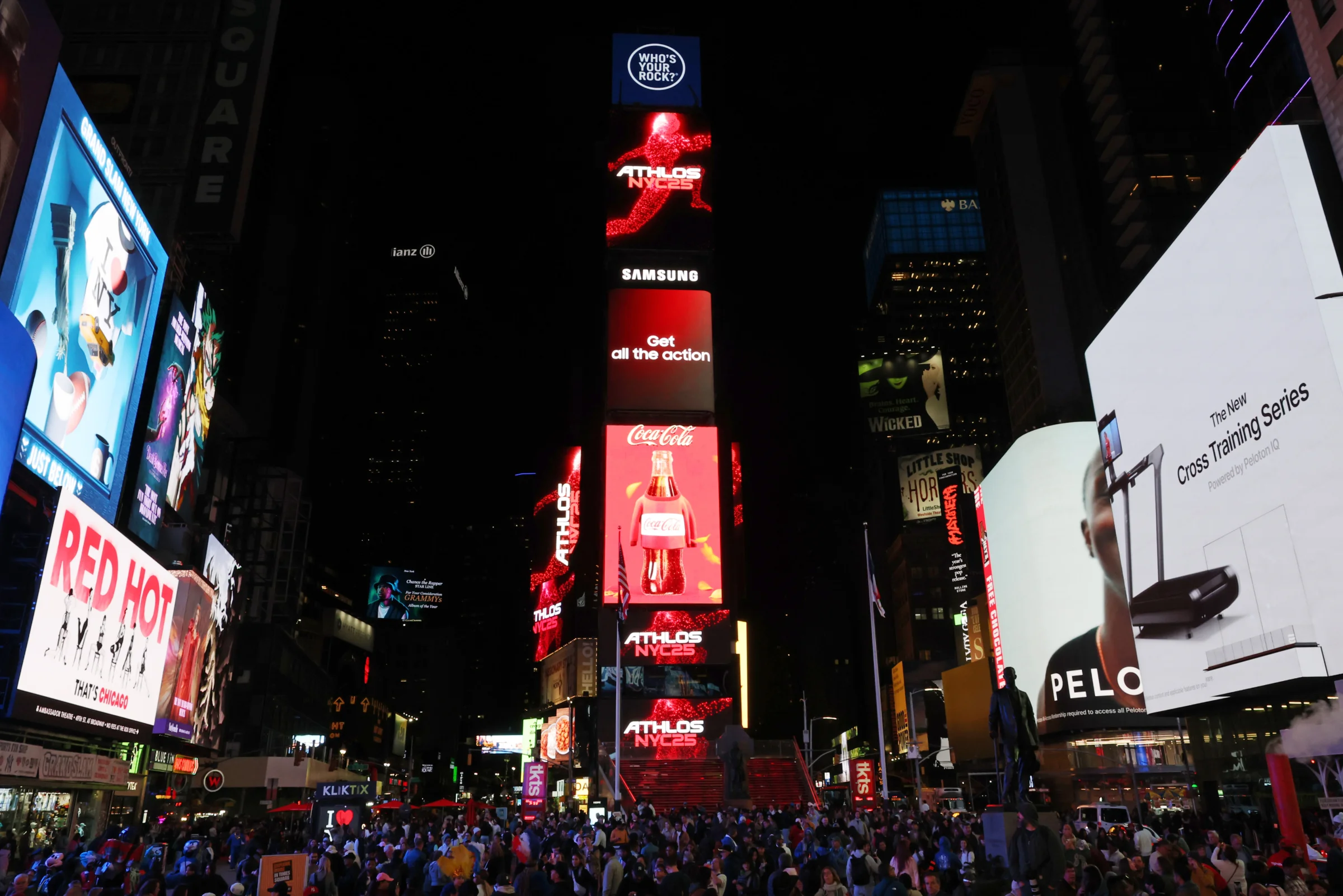 ATHLOS NYC billboards lighting up Times Square at night