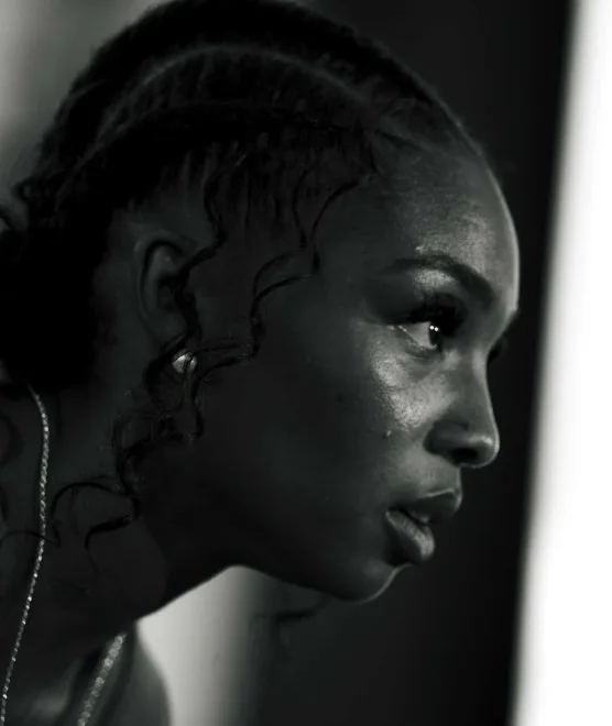 Black-and-white close-up portrait of an athlete in profile